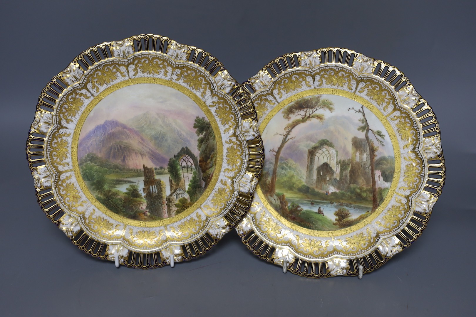 A pair of Coalport pierced border plates painted with named ruins scenes Airdale Abbey and Llanthony Abbey mark Coalport AD 1750 in blue 23cm